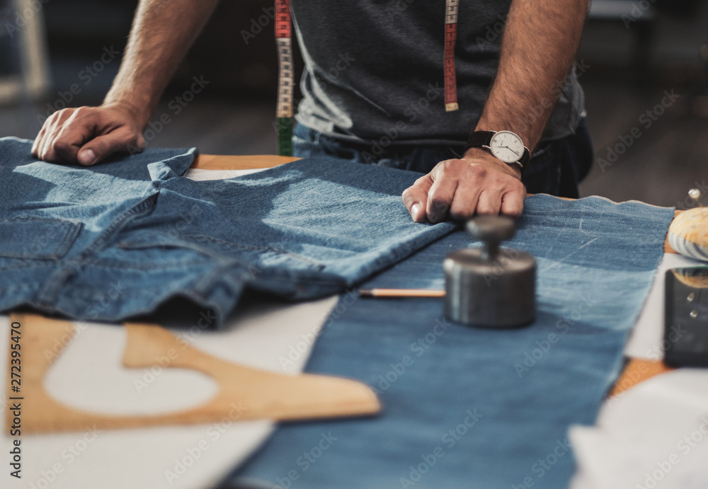 Fototapeta premium Fashion designer working in his studio