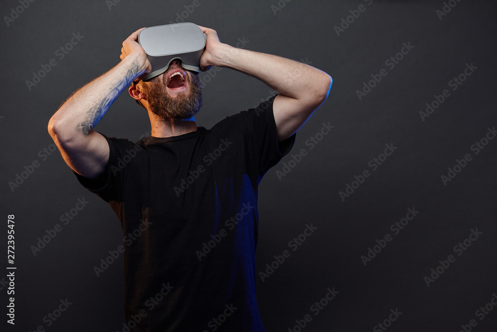 Man hipster with beard using virtual reality glasses Man hipster with beard using virtual reality glasses