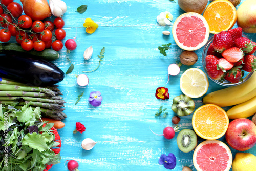 Fruitss on blue background. Top view with copy space. Healthy food concept. photo