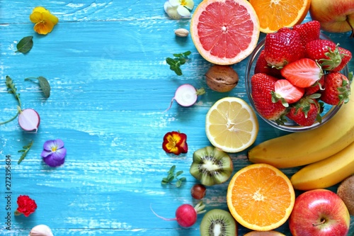 Fruitss on blue background. Top view with copy space. Healthy food concept. photo