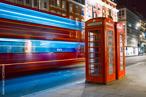 Photography Light trails of a double decker bus next to the iconic telephone booth in London