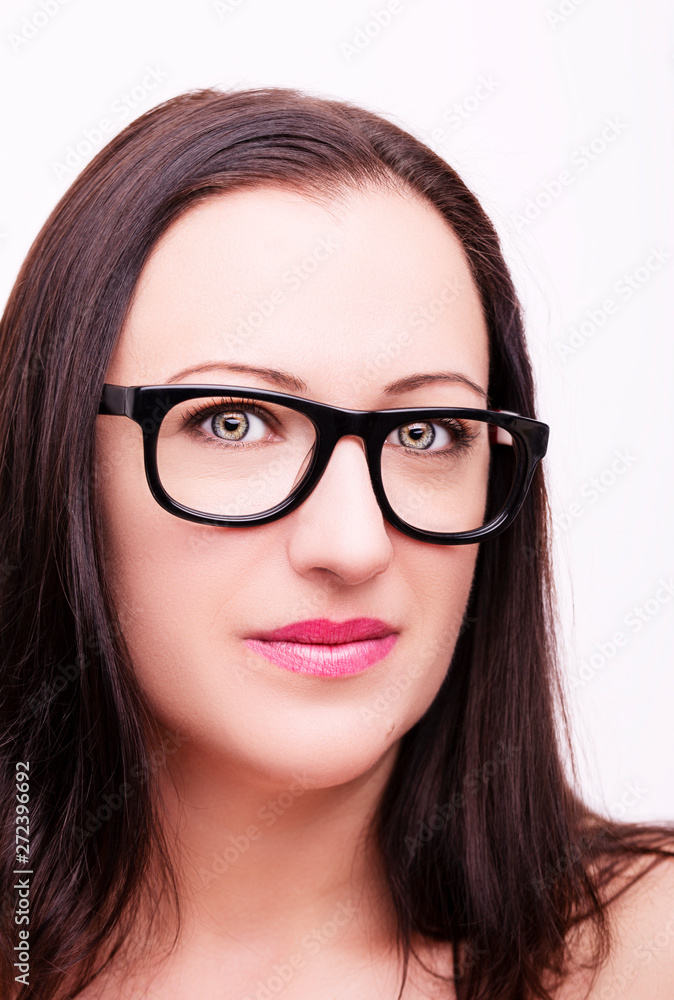 Beautiful young woman wearing glasses close-up isolated on white background