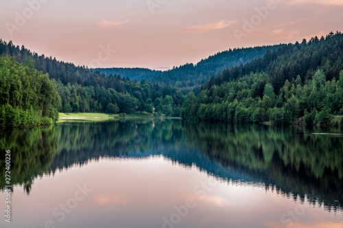 Tranquil mountain lake at sunset with reflections © funkenzauber