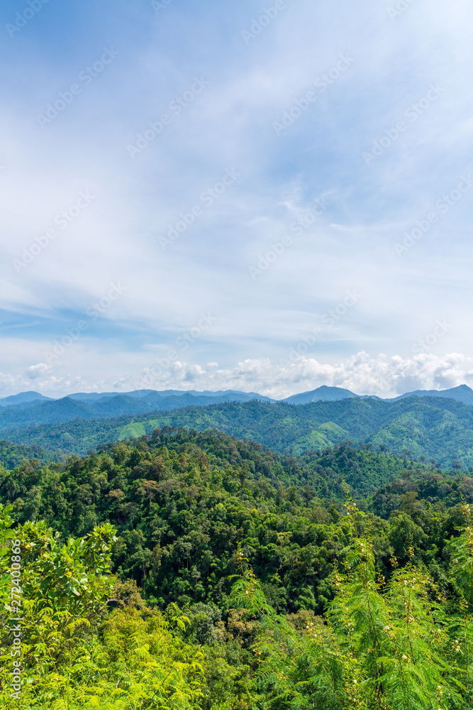 Obraz premium Blue sky high peak mountains fog hills mist scenery national park views at Phu Tub Berk, Khao Koh, Phetchabun Province, Thailand