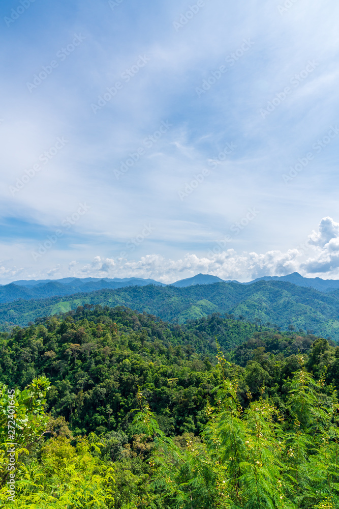 Obraz premium Blue sky high peak mountains fog hills mist scenery national park views at Phu Tub Berk, Khao Koh, Phetchabun Province, Thailand