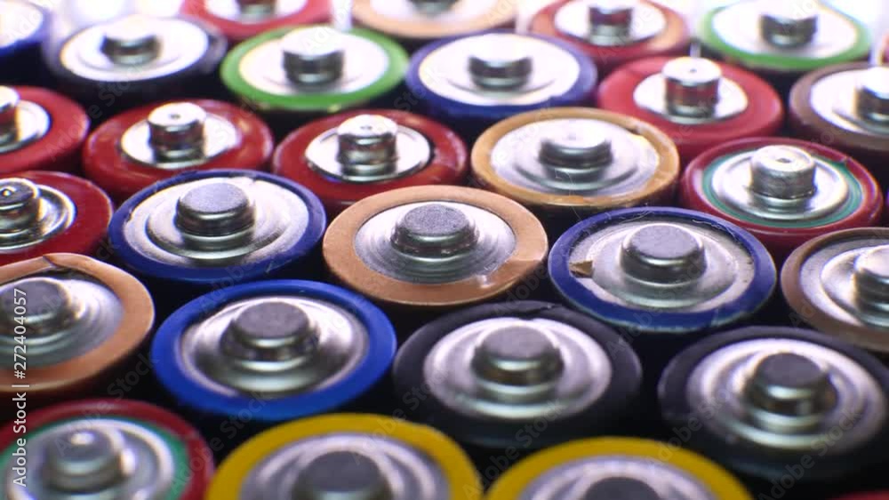 Lot of used batteries from different manufacturers. Electronic waste, collection and recycling, high danger for environment concept Lot of used batteries from different manufacturers. Electronic waste, collection and recycling, high danger for environment concept