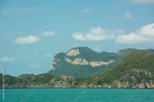 Big cliff above clear water of Siam sea