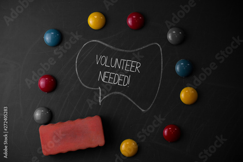 Handwriting text writing Volunteer Needed. Conceptual photo asking demonstrating to work for organization without being paid Round Flat shape stones with one eraser stick to old chalk black board