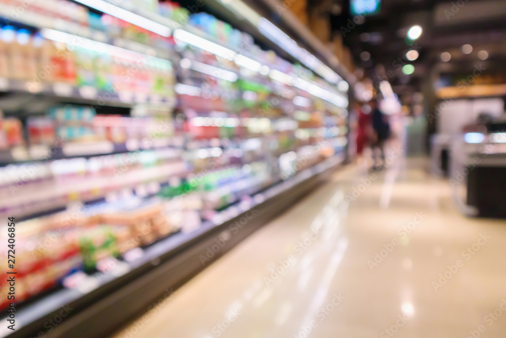 Abstract supermarket aisle interior blurred defocused background with bokeh light