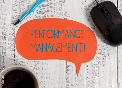 Writing note showing Perforanalysisce Management. Business concept for Improve Employee Effectiveness overall Contribution Wooden vintage table background coffee cup speech bubble photo