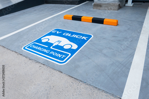 charging station for electric vehicle.outdoor car parking . blue sign EV quick charging point .