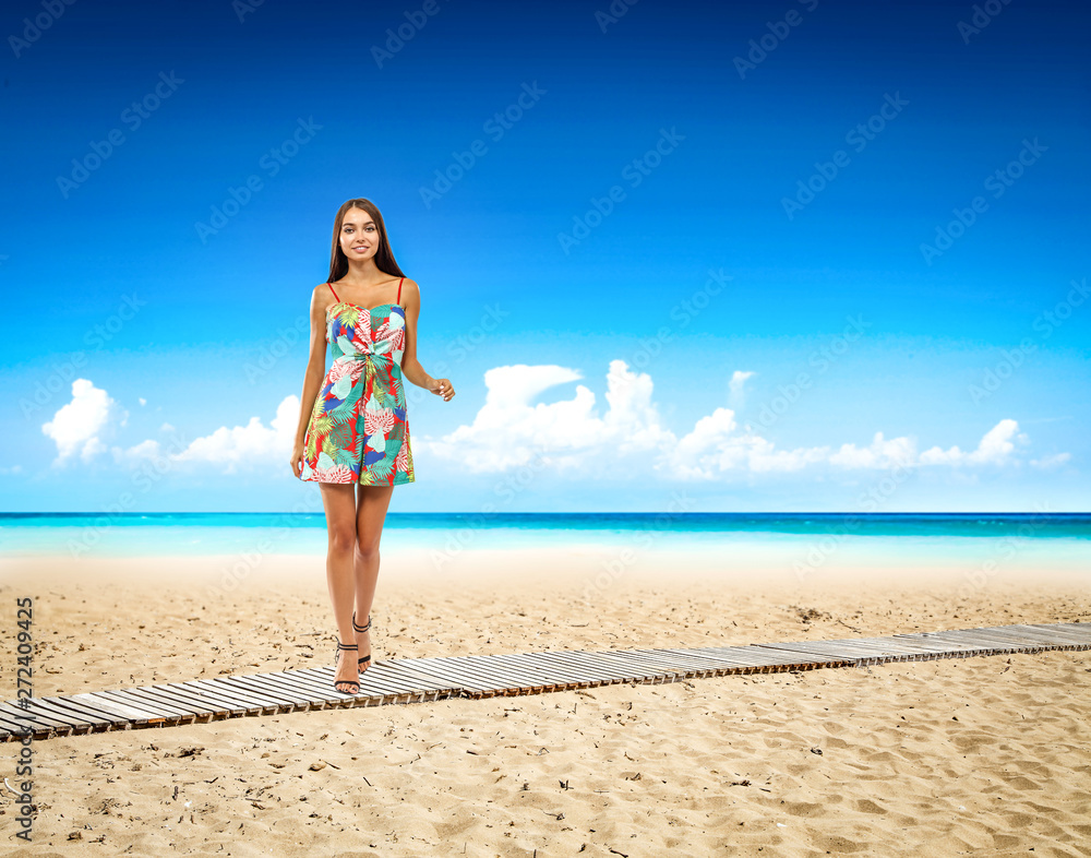 Slim young woman on beach and summer time 