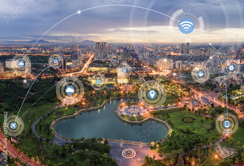 Fototapeta Naklejka Na Ścianę i Meble -  Smart city and wireless communication network concept. Digital network connection lines of Hanoi city at twilight period. Cau Giay park, west of Hanoi