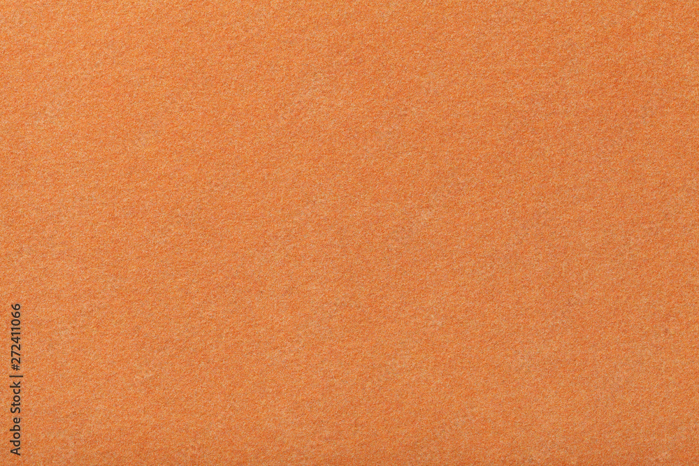 Light orange matt suede fabric closeup. Velvet texture of felt. Light orange matt suede fabric closeup. Velvet texture of felt.