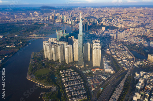 Top View of Building in a City - Aerial view Skyscrapers flying by drone of Ho Chi Mi City with development buildings, transportation, energy power infrastructure. include Landmark 81 building  © Nhut