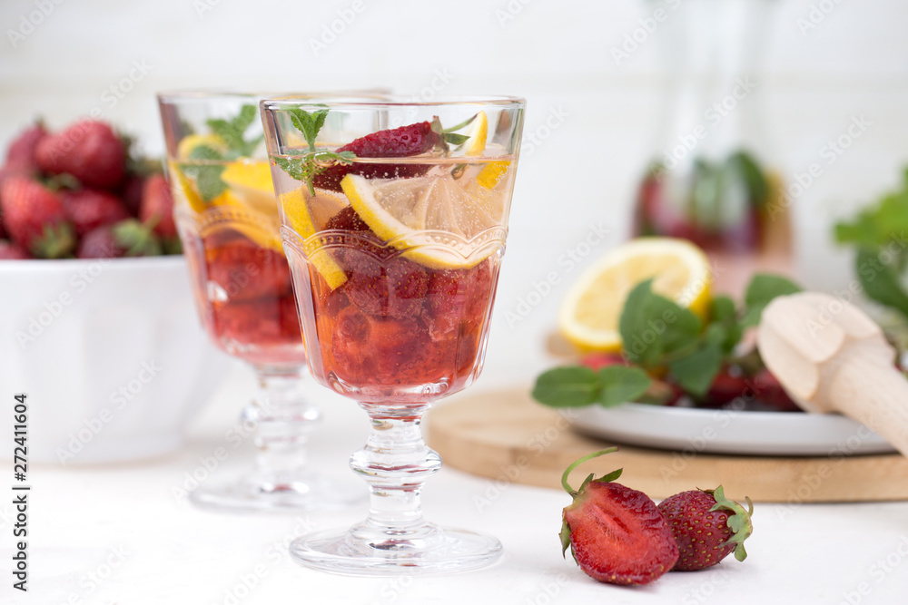 A glass of detox water. Strawberry, lemon and mint with cool clean water. A glass of detox water. Strawberry, lemon and mint with cool clean water.