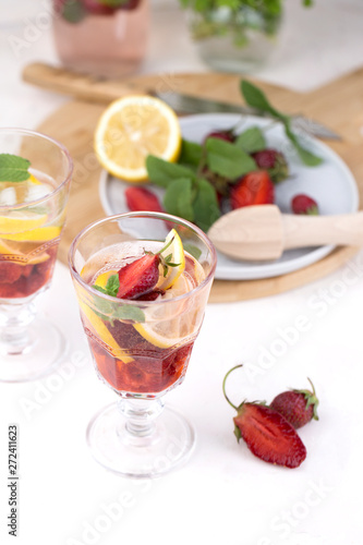 A glass of detox water. Strawberry, lemon and mint with cool clean water.