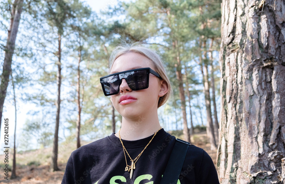 Teenage girl with some big sunglasses on Teenage girl with some big sunglasses on