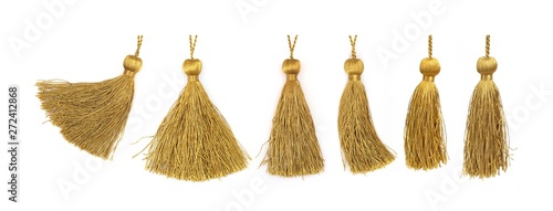 Golden silk tassels isolated on white background for creating graphic concepts photo