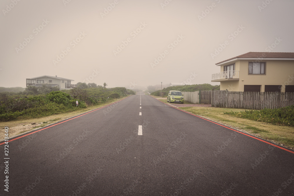 Road in Sedgefiled town on a foggy morning, South Africa