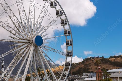 Ferris wheel and Table Mountain view at Waterfront in Cape Town