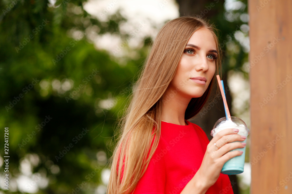 woman drinking milkshake