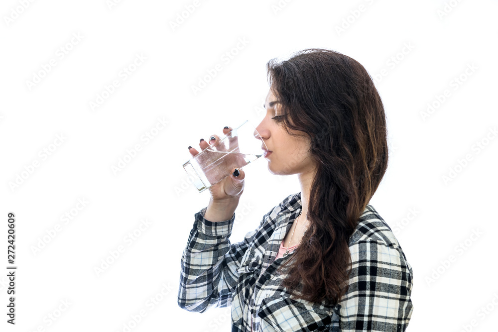 Woman drinking water from glass isolated on white Woman drinking water from glass isolated on white