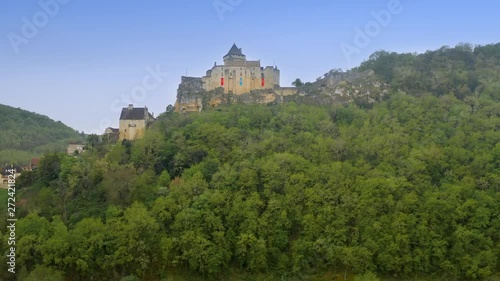 Aerial view crossing Dordogne river with environment full of fog and low clouds in Castle Castelnaud - La Chapelle. Dordogne department in Nouvelle-Aquitaine in southwestern France. photo