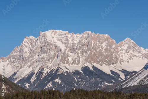 Germany highest mountain the Zugspitze..In winter, the mountain is full of beauty, with many trees in the valley and snow on top of the mountain.