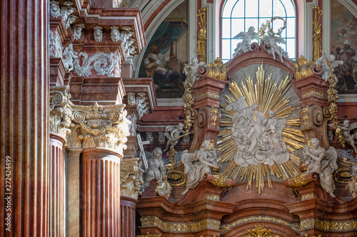 baroque interior of the Parish Church "Poznanska Fara". Column details. Poznań, Poland.