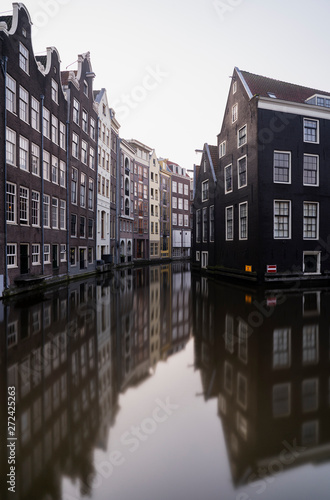 Canalhouses and reflections in Amsterdam  photo