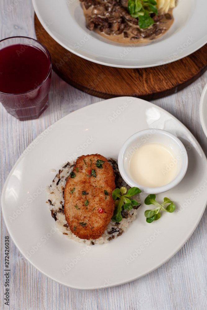 Crunchy chicken cutlet with steamed rice as a part of healthy lunch Crunchy chicken cutlet with steamed rice as a part of healthy lunch