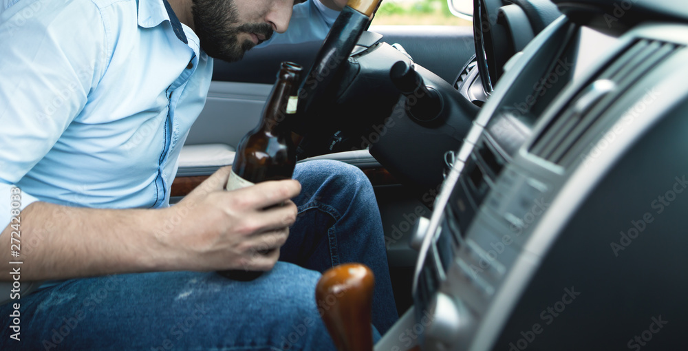 Drunk young man driving a car; sleeping, Drunk young man driving a car; sleeping,