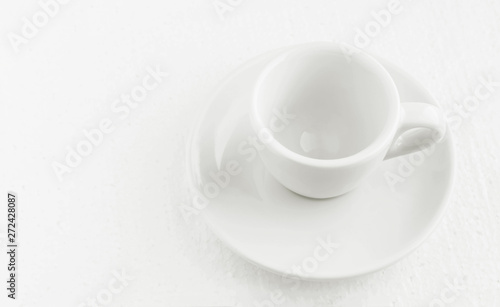 closeup top view on white coffee cup and saucer  empty coffee-free coffee cup  for black coffee  on a white background