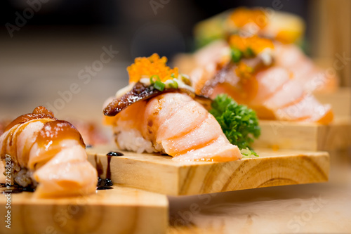 Close up salmon aburi sushi in Japanese sushi restaurant