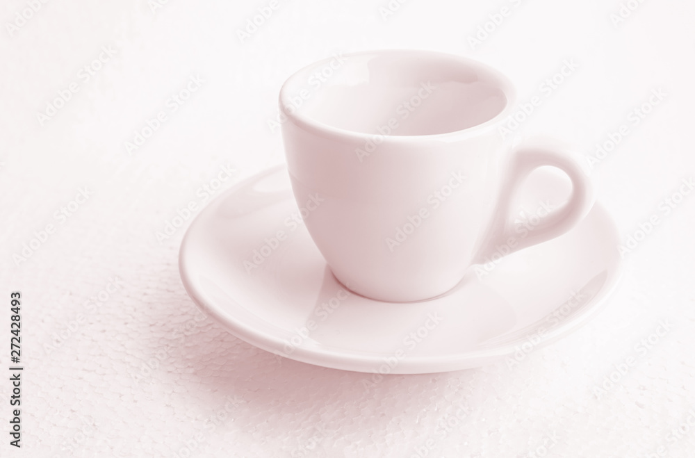 tinted in pink white coffee cup and saucer, empty coffee-free coffee cup, front view from above, or black coffee, on a white background tinted in pink white coffee cup and saucer, empty coffee-free coffee cup, front view from above, or black coffee, on a white background