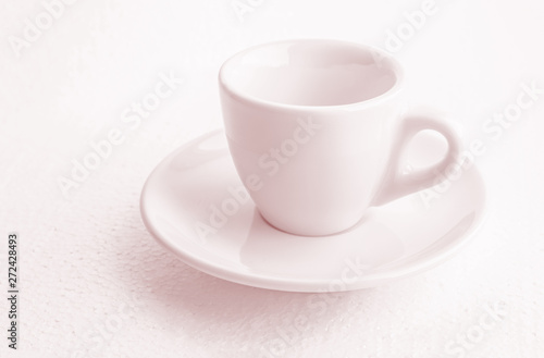 tinted in pink white coffee cup and saucer, empty coffee-free coffee cup, front view from above, or black coffee, on a white background