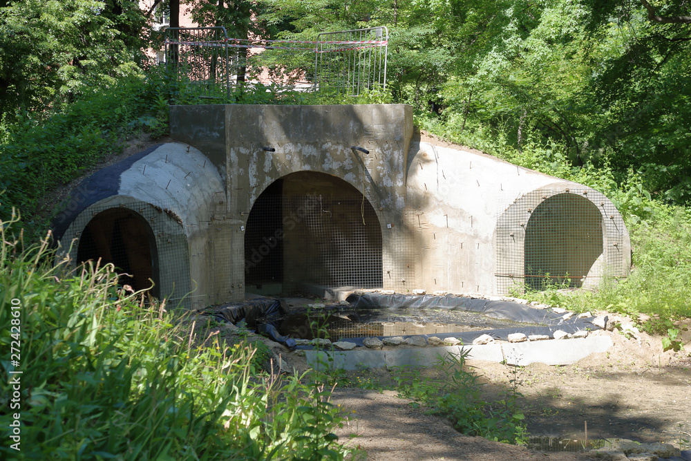 Unfinished bomb shelter made of durable concrete in a city block Unfinished bomb shelter made of durable concrete in a city block
