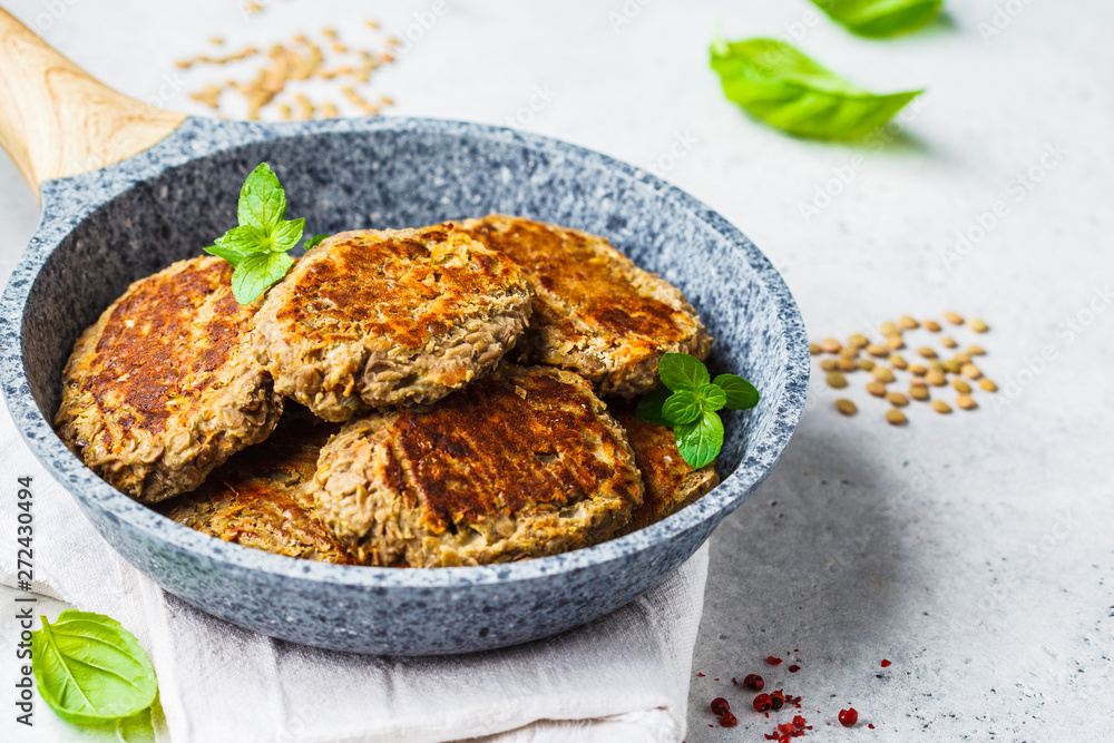 Lentil cutlets in gray frying pan. Healthy vegan food concept. Lentil cutlets in gray frying pan. Healthy vegan food concept.