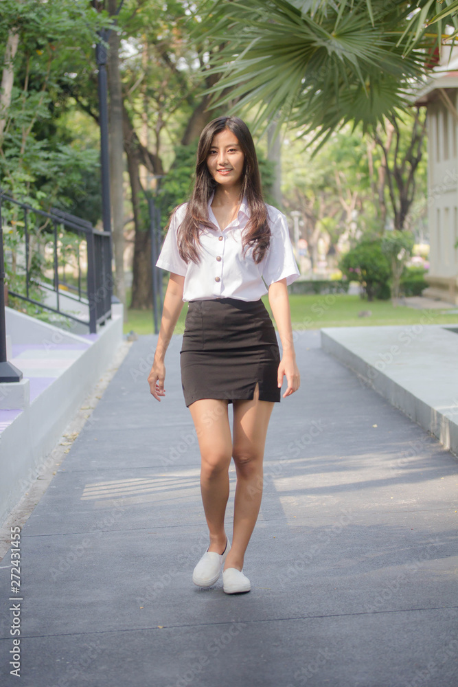 Portrait of thai adult student university uniform beautiful girl relax and smile