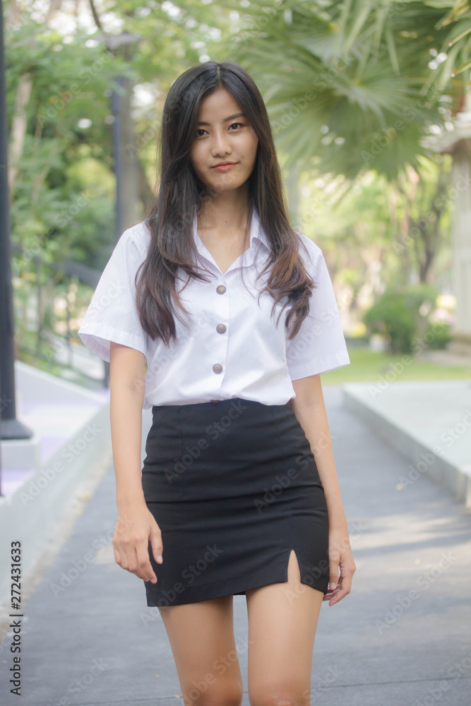 Portrait of thai adult student university uniform beautiful girl relax and smile
