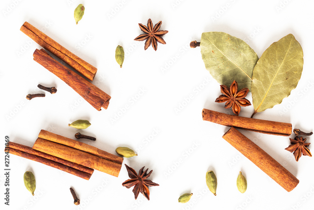 Healthy food concept Mix of organic spices star anise, cinnamon, bay and cardamom pods on white background - obrazy, fototapety, plakaty 