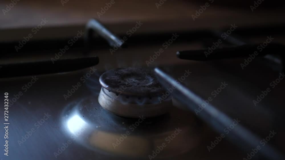 Gas is switching on, apearing blue flame. Gas stove Gas is switching on, apearing blue flame. Gas stove