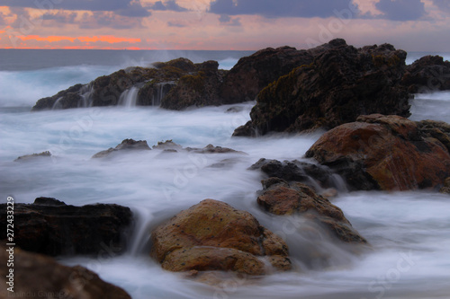 waves crashing on rocks