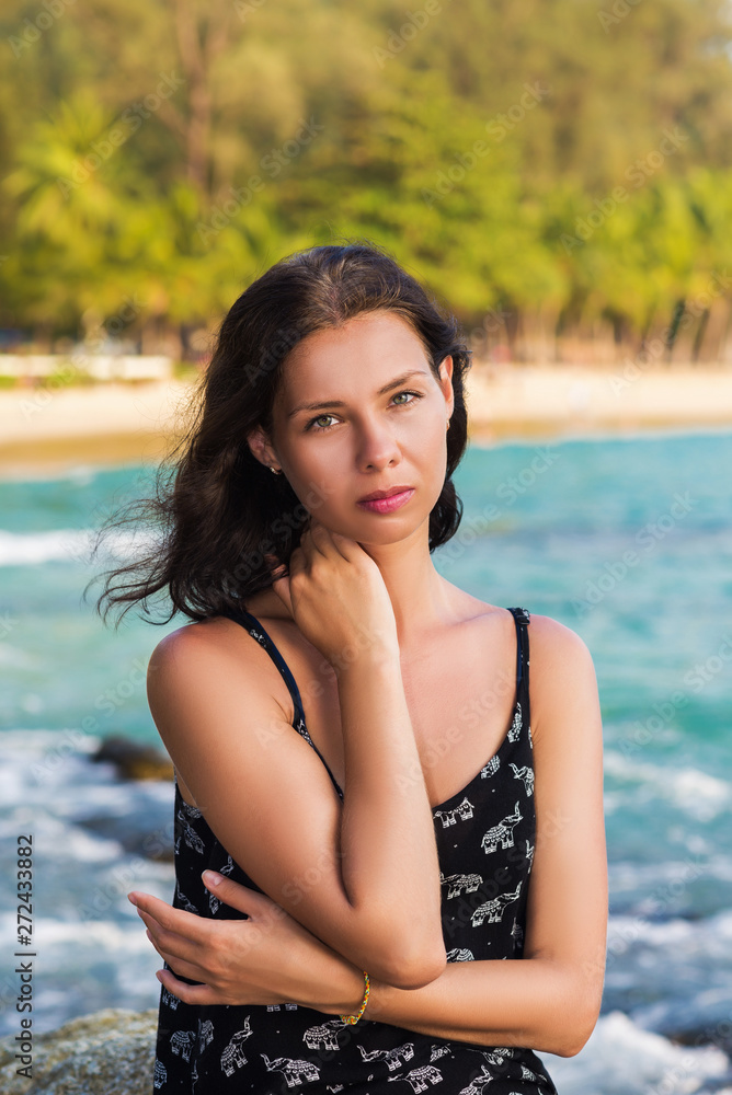 Young woman over tropical sea and beach background Young woman over tropical sea and beach background