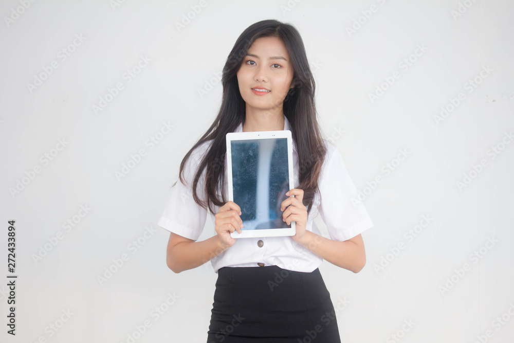 Portrait of thai adult student university uniform beautiful girl using her tablet. Portrait of thai adult student university uniform beautiful girl using her tablet.
