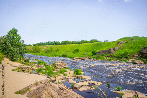 Sablinsky waterfalls. Little waterfall. The brown water of the waterfall.. Thresholds on the river. Strong water flow. Jets of water. Fast current