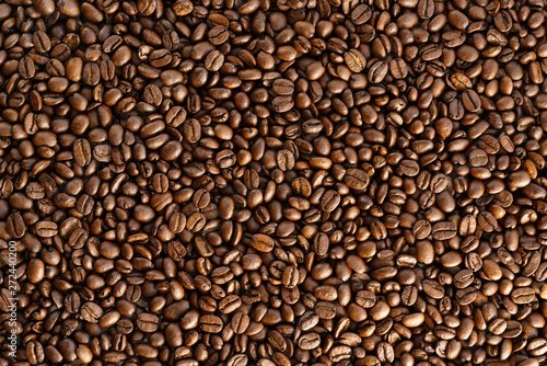 Roasted coffee beans on a table. Top view, high resolution
