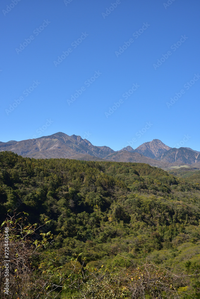 Mountains with red leaves and blue sky