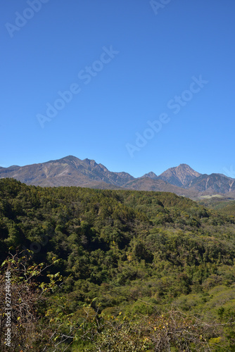 Mountains with red leaves and blue sky